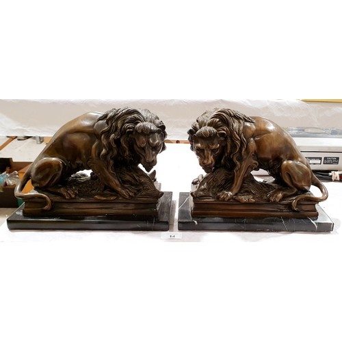 14 - A pair of cast brass reproduction lions, length 11.5