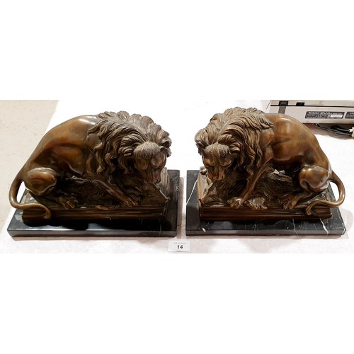 14 - A pair of cast brass reproduction lions, length 11.5