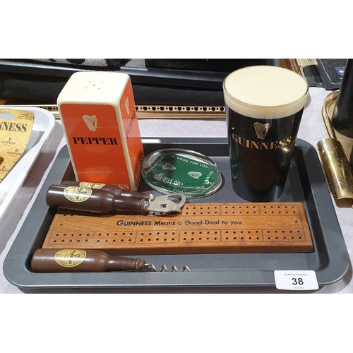 38 - A tray of vintage Guinness memorabilia including a bar top advertisement. UK shipping £14.