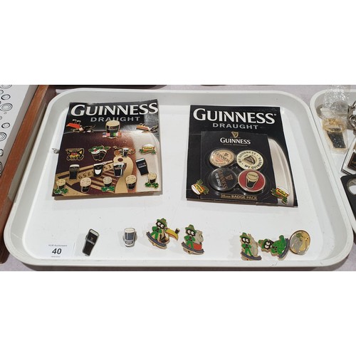 40 - A selection of Guinness badges. UK shipping £14.