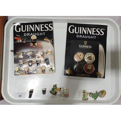 40 - A selection of Guinness badges. UK shipping £14.