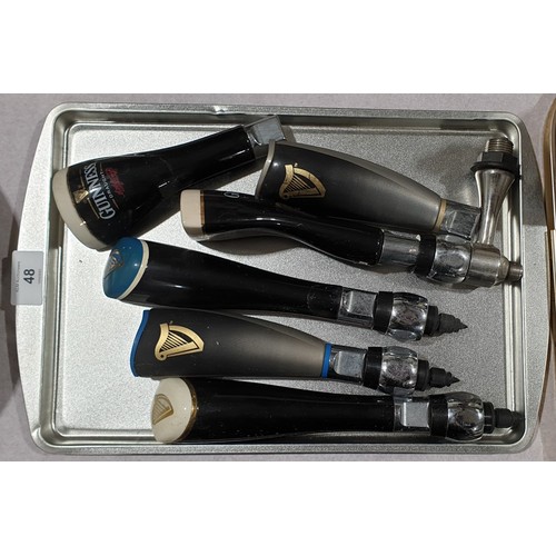 48 - Six vintage and later Guinness bar top pump taps, two A/F. UK shipping £14.