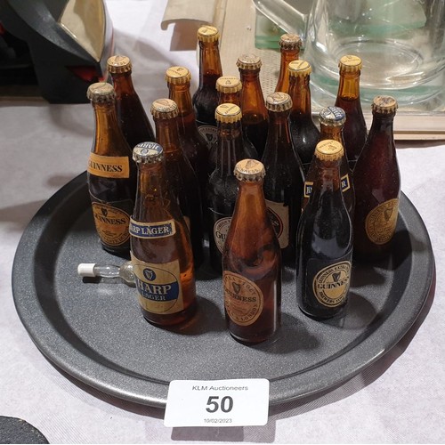 50 - Fifteen vintage miniature glass Guinness bottles and two Harp bottles. UK shipping £14.