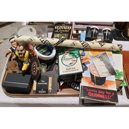 54 - A selection of Guinness memorabilia. UK shipping £14.