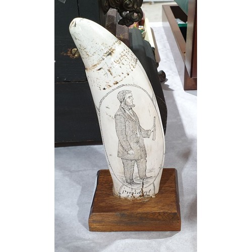 111 - A resin scrimshaw on a wooden base, height 7