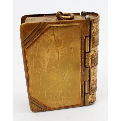 356 - A vintage brass vesta case in the form of a book, length 2