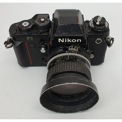 363 - A Nikon F3 camera with a Nikon 24mm lens. UK shipping £14.