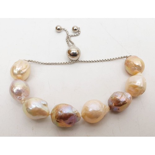 376 - A Honora silver and pearl bracelet with a soft case. UK shipping £14.