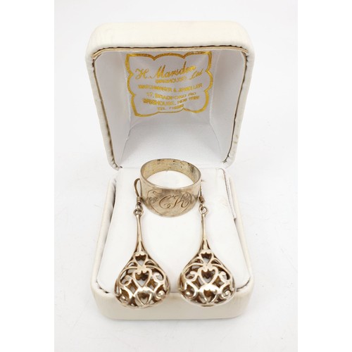 379 - A pair of silver pierce work drop earrings and a white metal ring. UK shipping £14.