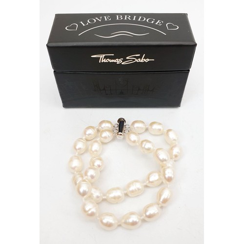 382 - A boxed Thomas Sabo silver and pearl bracelet. UK shipping £14.