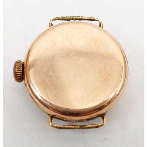 384 - A lady's 9ct gold cased watch, A/F. UK shipping £14.