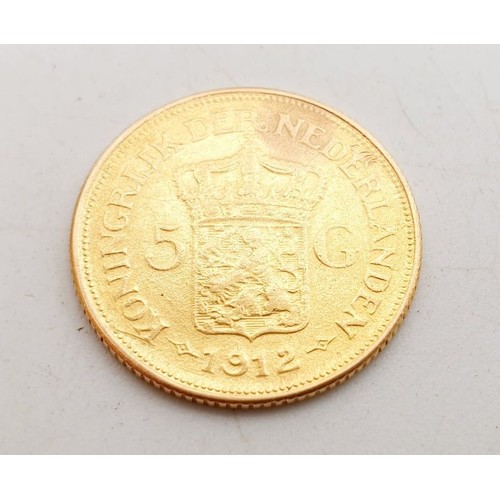 388 - A scarce 1912 Dutch gold five Guilders Wilhelmina coin, weight 3.3g. UK shipping £14.