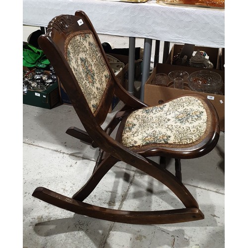 140 - A reproduction folding rocking nursing chair. No shipping. Arrange collection or your own packer and... 