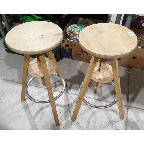 141 - Two wooden adjustable stools. No shipping. Arrange collection or your own packer and shipper, please... 