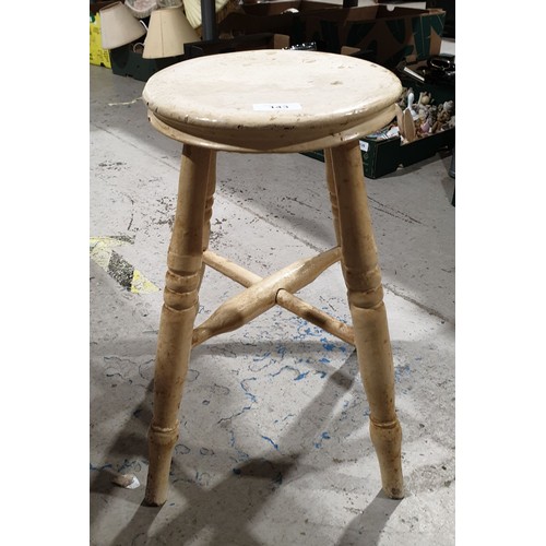 143 - An antique four-legged stool. No shipping. Arrange collection or your own packer and shipper, please... 