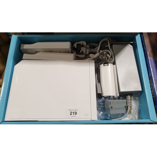 219 - A boxed Nintendo Wii console, a Wii power station and High School Musical 3 Dance! UK shipping £14.