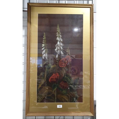 253 - An early 20th century oil painting depicting foxgloves and poppies, 27.75