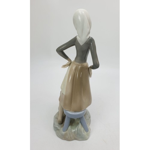 268 - A Lladro figure of a girl with a goose, height 9