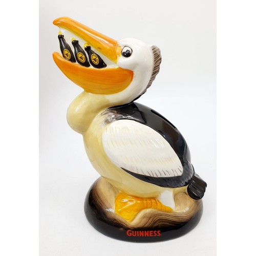 277 - A boxed Guinness moneybox in the form of a pelican, height 8.5