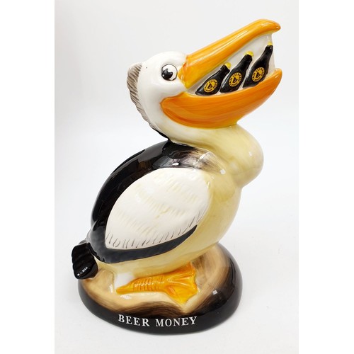 277 - A boxed Guinness moneybox in the form of a pelican, height 8.5