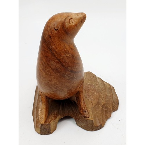 283 - A vintage Canadian Inuit carving of a seal, height 4.5