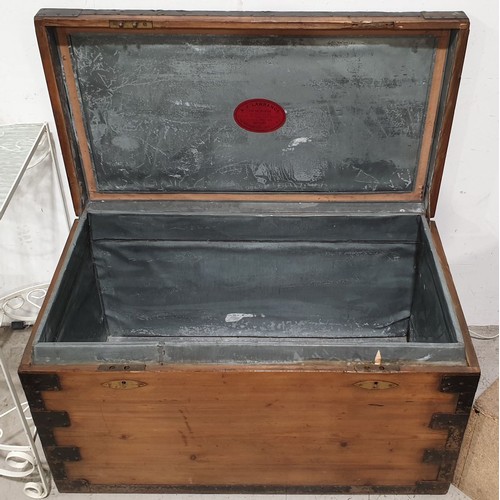 314 - An antique iron bound pine chest lined with tin by A. J. Lawrance, London, width 36