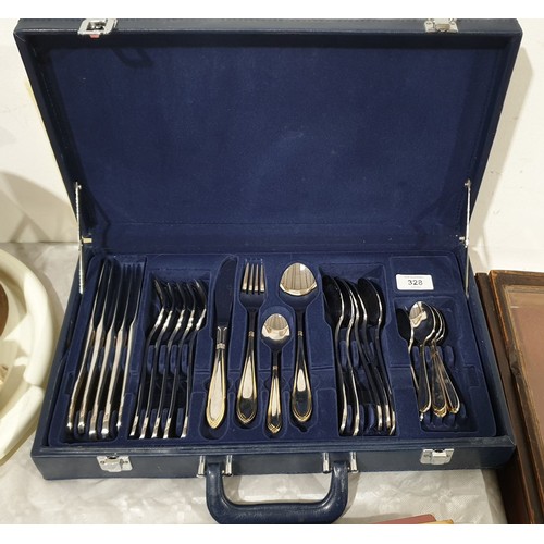 328 - A briefcase of Suissine cutlery. UK shipping £14.