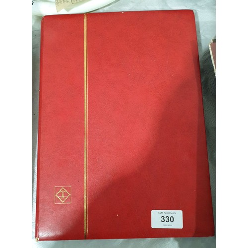 330 - A stamp album including a Penny Red and other Victorian stamps. UK shipping £14.