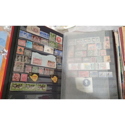 330 - A stamp album including a Penny Red and other Victorian stamps. UK shipping £14.