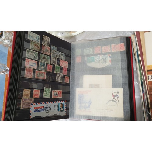 330 - A stamp album including a Penny Red and other Victorian stamps. UK shipping £14.