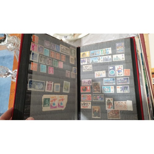 330 - A stamp album including a Penny Red and other Victorian stamps. UK shipping £14.