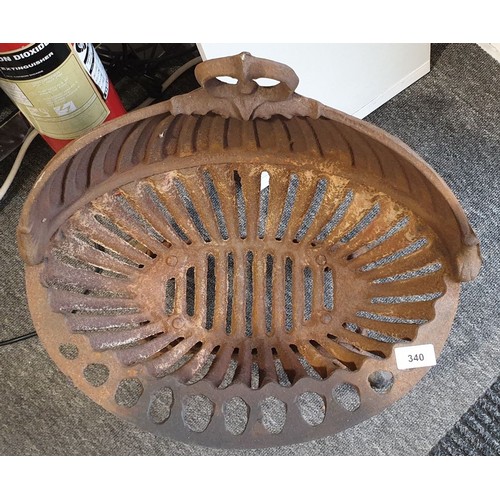 340 - A cast iron dog grate, width 19