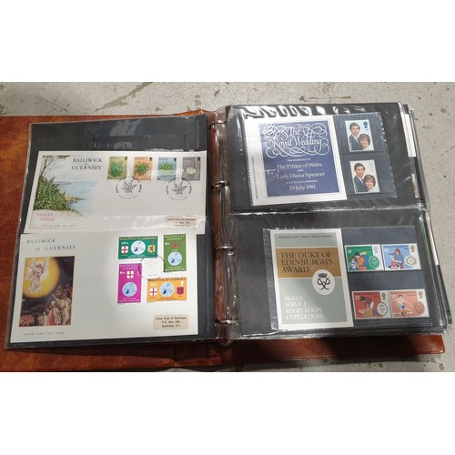 399 - A folder of first day covers and loose first day covers. UK shipping £14.