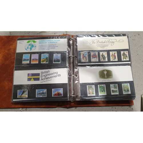 399 - A folder of first day covers and loose first day covers. UK shipping £14.