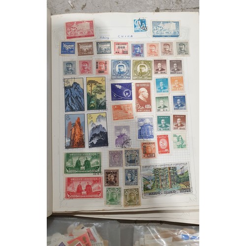 401 - A stamp album and loose stamps. UK shipping £14.