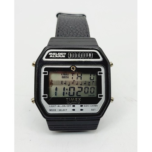 352 - A vintage Timex Melody alarm digital watch, with box. UK shipping £14.