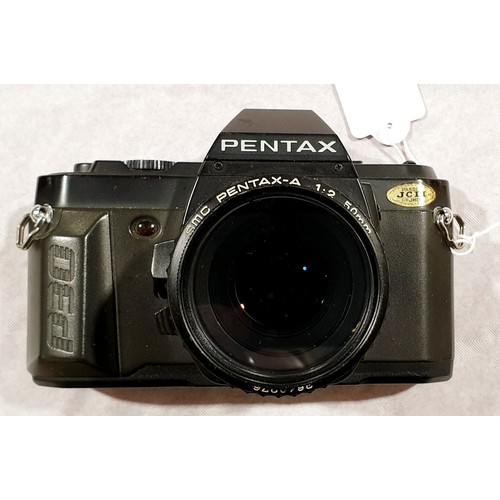 10 - A Pentax P30 camera with a 50mm lens. UK shipping £14.