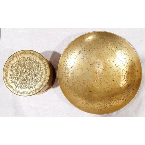 25 - A lidded canister made from brass shell casing dated 1912 and decorated in the Islamic style, height... 