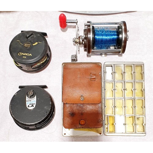 63 - A Shakespeare Targra 3630 fishing reel, a DFR Rim Fly reel and a Fisherman 151 fishing reel together... 