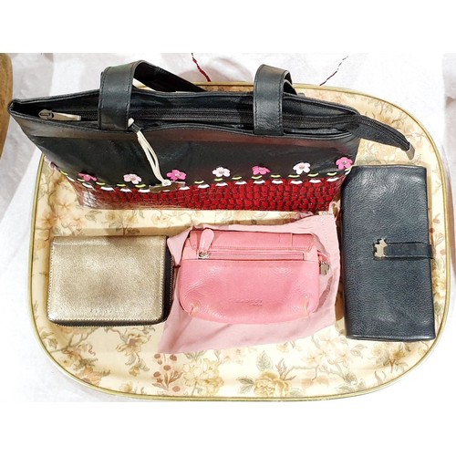 103 - A Radley handbag and three Radley purses. UK shipping £14.