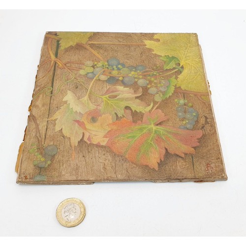 317 - An antique oil on panel painting depicting grapes and vine leaves monogrammed lower right, 7