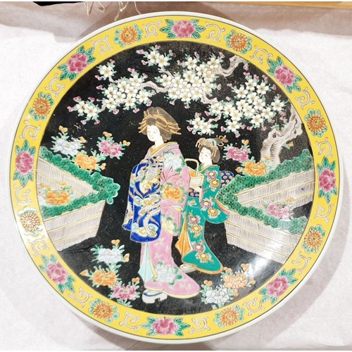 467 - A vintage Japanese charger decorated with figures in a garden, diameter 14.5. No shipping.  Arrange ... 