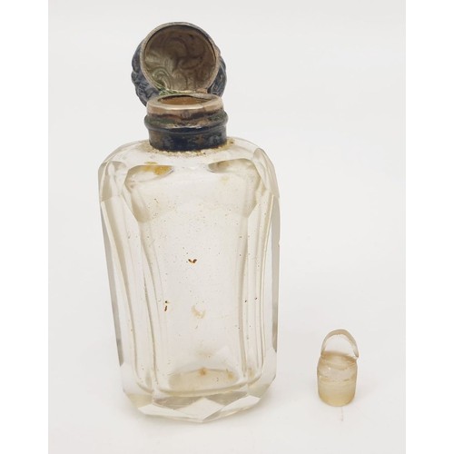 404 - A cut glass perfume bottle with white metal top and inner glass stopper, height 2.25