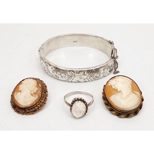 3 - A hallmarked silver bangle, Birmingham 1962, weight 21g together with a white metal cameo ring and t... 