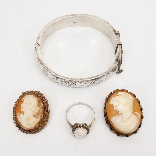 3 - A hallmarked silver bangle, Birmingham 1962, weight 21g together with a white metal cameo ring and t... 