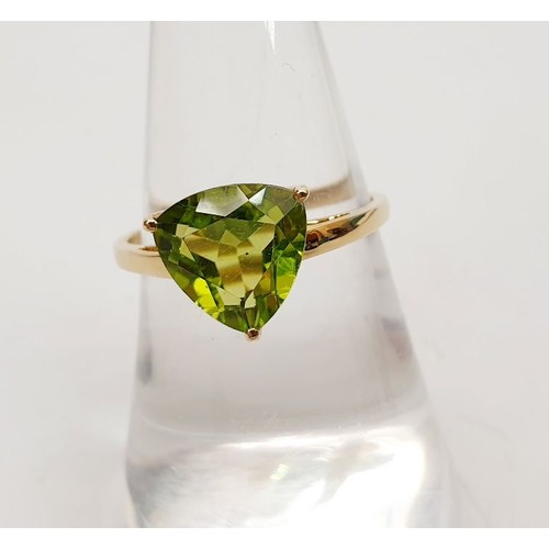 5 - A hallmarked 9ct gold ring set with a peridot, size N/O, gross weight 1.8g. UK shipping £14.