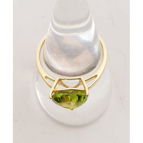 5 - A hallmarked 9ct gold ring set with a peridot, size N/O, gross weight 1.8g. UK shipping £14.