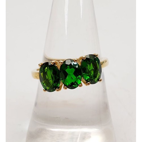 6 - A 9ct gold ring set with diopside, size N/O, gross weight 2.5g. UK shipping £14.