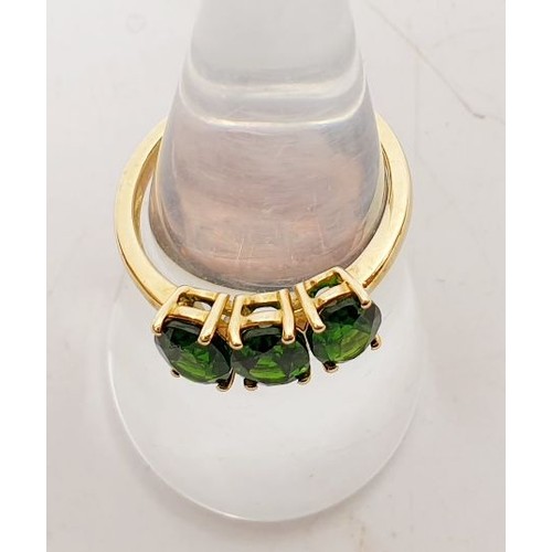 6 - A 9ct gold ring set with diopside, size N/O, gross weight 2.5g. UK shipping £14.