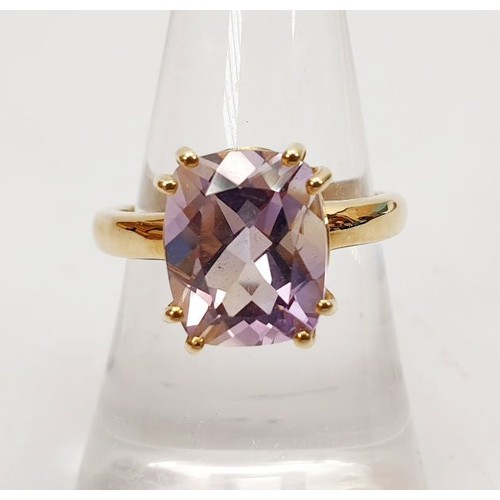 7 - A hallmarked 9ct gold ring set with an amethyst, size N/O, gross weight 3.3g. UK shipping £14.